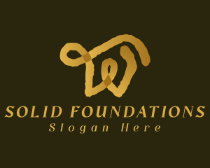 Gold Ink Letter W logo