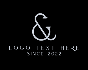 Silver Ampersand Lettering logo
