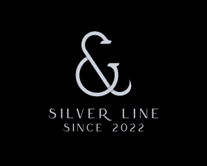 Silver Ampersand Lettering logo