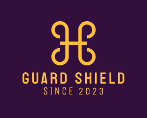 Golden Shield Letter H logo