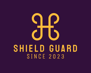 Golden Shield Letter H logo