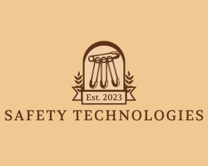Tailor Safety Pin Sash logo