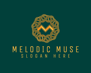 Intricate Gold Letter M logo design