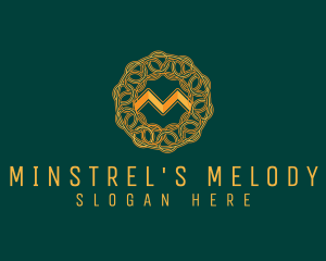 Intricate Gold Letter M logo design