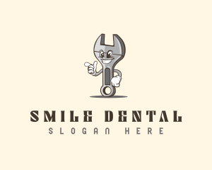 Smiling Wrench Happy logo design