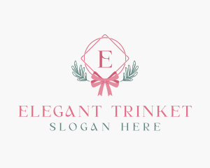 Ribbon Leaf Ornament logo